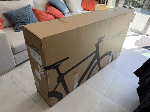 The Tezeus C8 repacked in its original cardboard box, ready for return collection