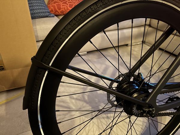 Close-up of the rear mudguard touching the rear tyre